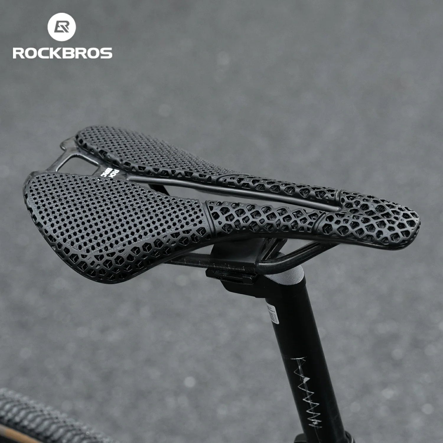 Bicycle saddle with textured design on a gray background, featuring the RockBros brand.