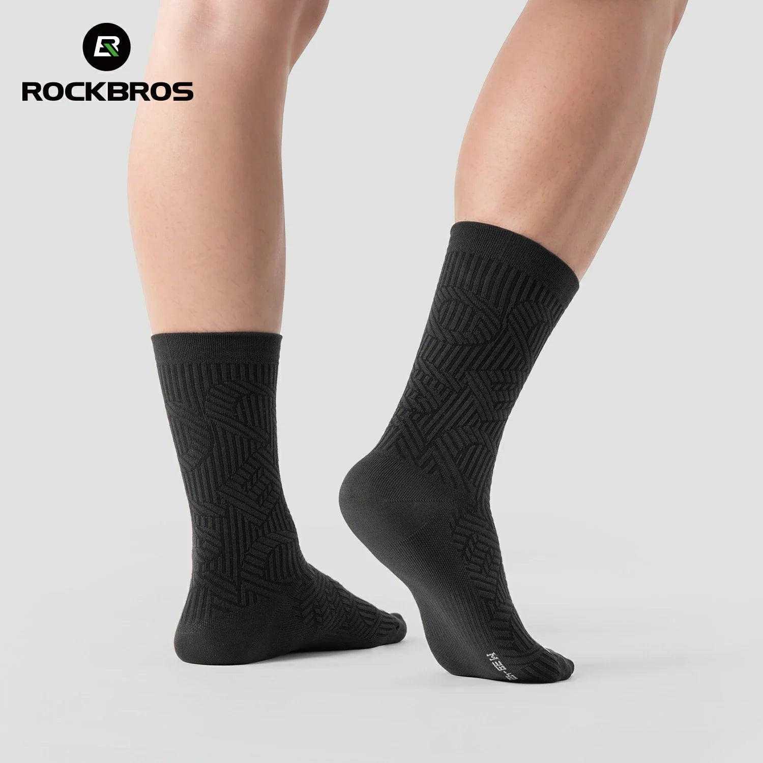 Black socks with geometric pattern worn by a person on a light gray background, featuring the RockBros brand.