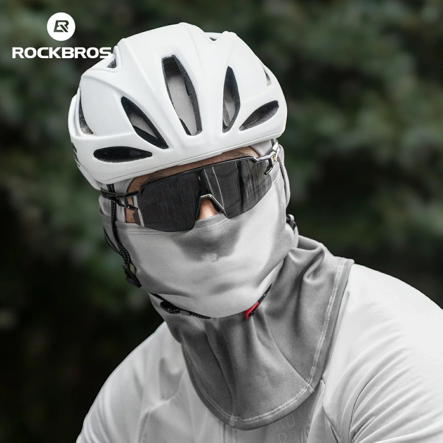Person wearing a white helmet and gray balaclava with ROCKBROS logo in the corner.#color_Dark Gray
