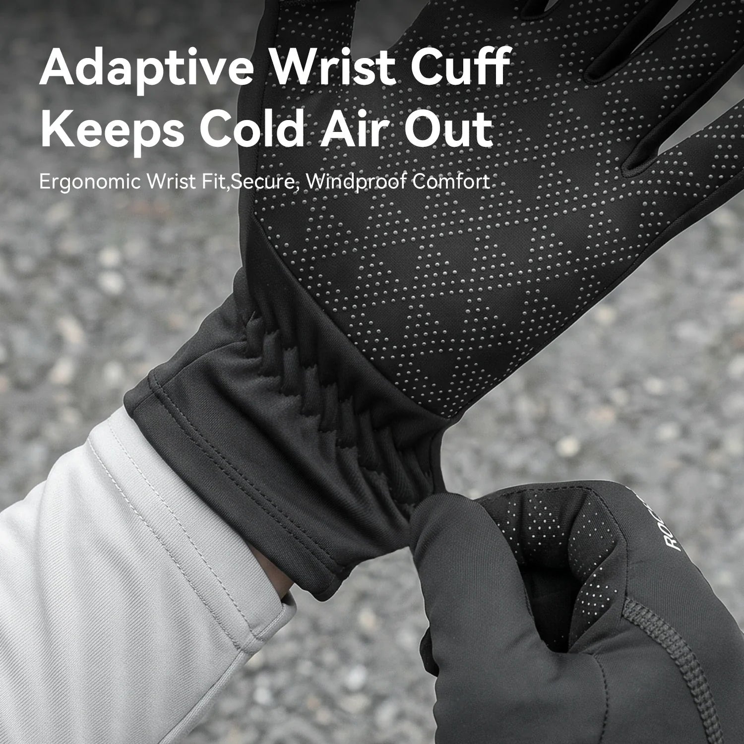 Black insulated gloves with an adaptive wrist cuff being worn, featuring a textured grip pattern on the back of the hand. The image includes promotional text overlay: 'Adaptive Wrist Cuff Keeps Cold Air Out'.
