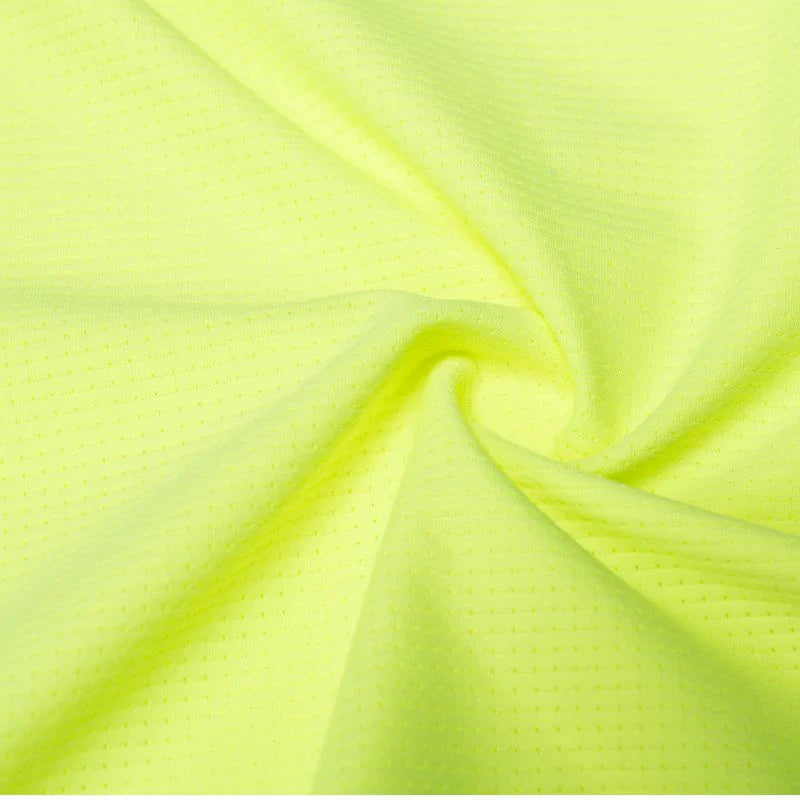 Close-up of bright green fabric with a textured pattern