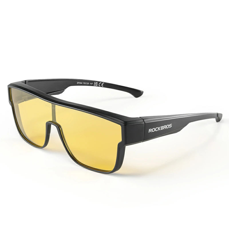 Black wrap-around sunglasses with yellow lenses, featuring the ROCKBROS logo on the temple arm, set against a plain white background. #Color_Yellow-Black
