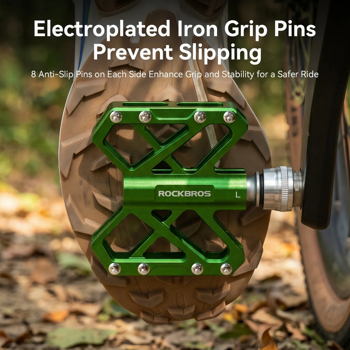 Close-up of the anti-slip pins on a green bike pedal