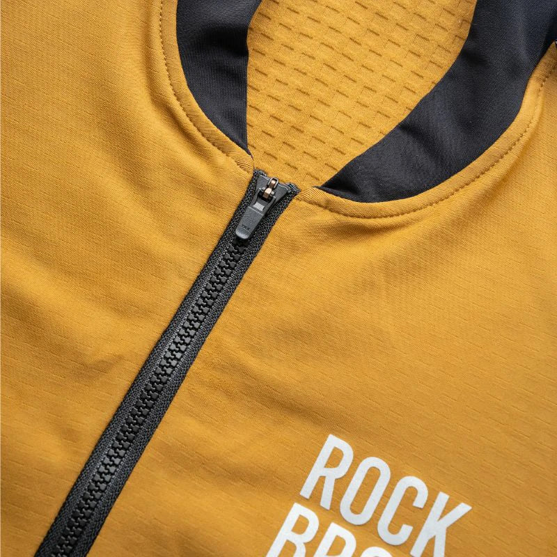 Close-up of a mustard yellow jacket with a black zipper and 'ROCKBROS' text. #color_Brown