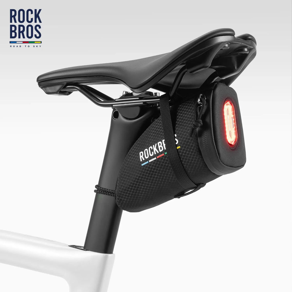 Saddle bag and rear light shown mounted on a bicycle