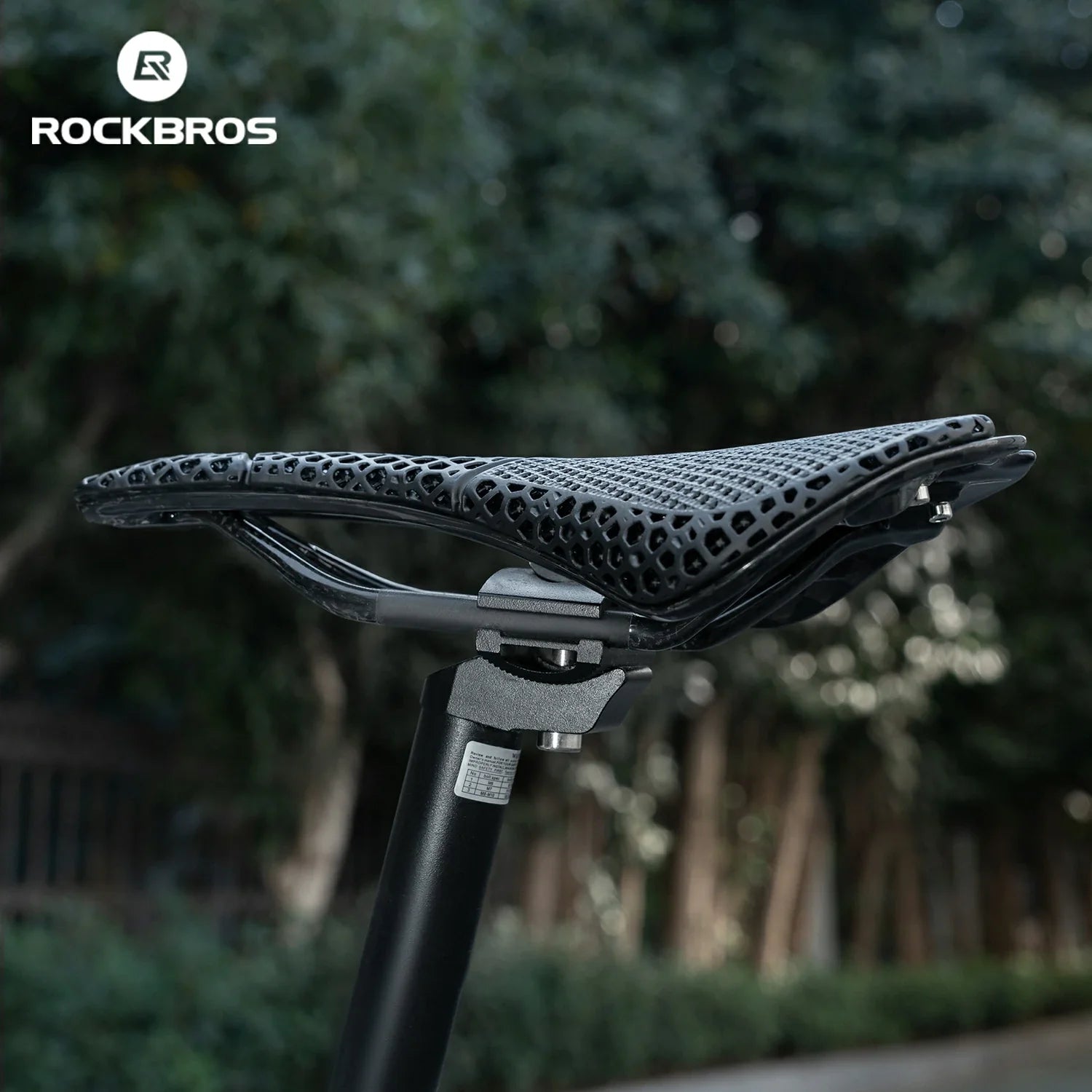 Bicycle seat with a blurred natural background and RockBros branding.