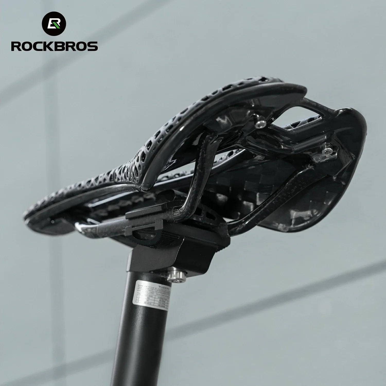 Close-up of a bicycle seat with 'RockBros' branding on a gray background