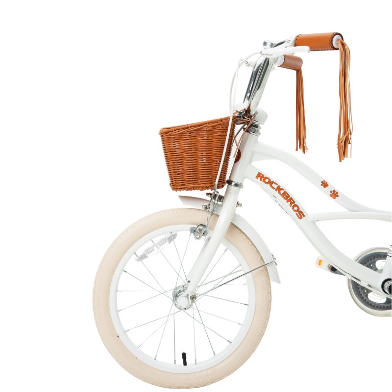 White children's bicycle with a brown basket and leather handlebar straps on a white background  #color_white