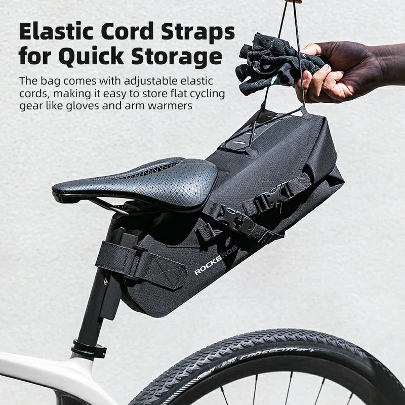 Bicycle saddle bag with elastic cord straps for storing cycling gear on a bike.