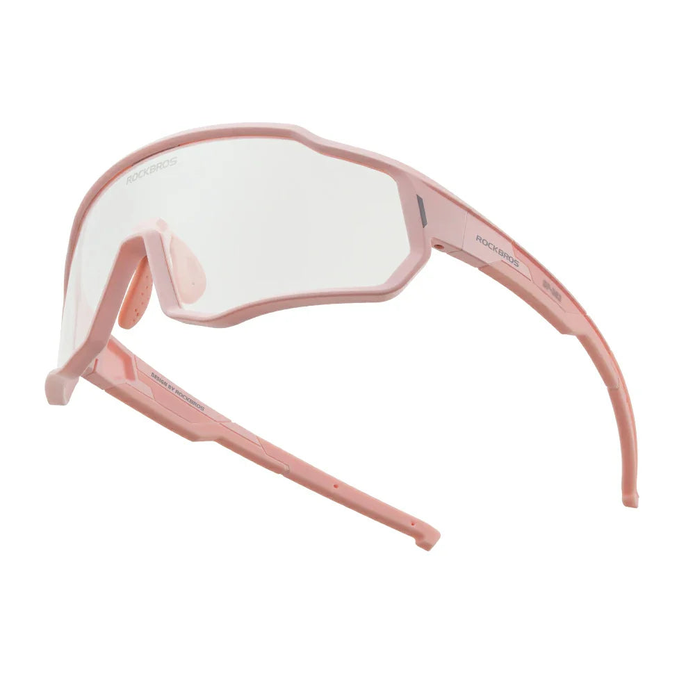 Pink safety goggles with clear lenses on a white background #color_Light Pink / Photochromic Clear