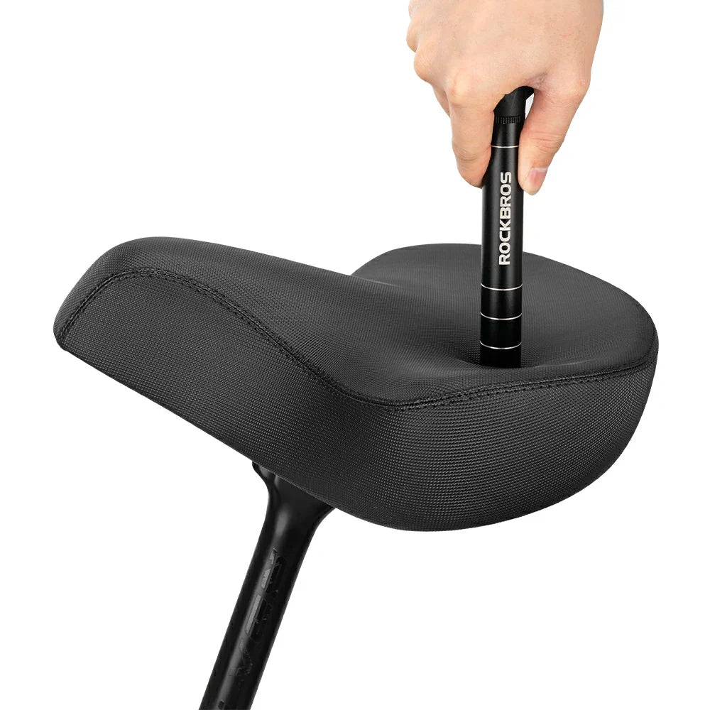 Black bicycle seat with a hand holding a black handlebar grip featuring 'RockBros' branding on a white background.