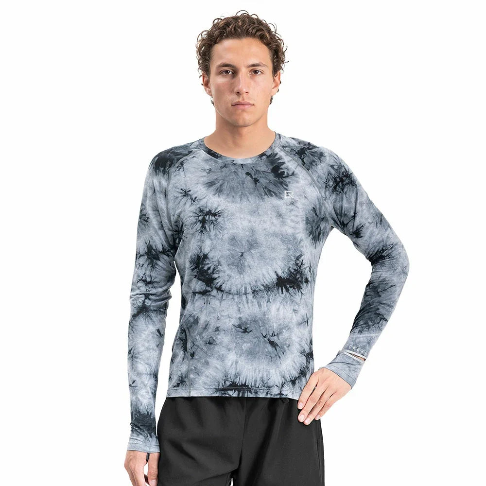 Model wearing a blue-gray long-sleeve running shirt