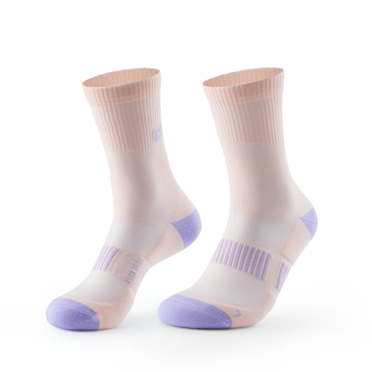 A pair of crew-length athletic socks in a light peach-beige color with lavender purple accents on the toes, heels, and striped arch support area, shown against a plain white background. #Color_Pink*2