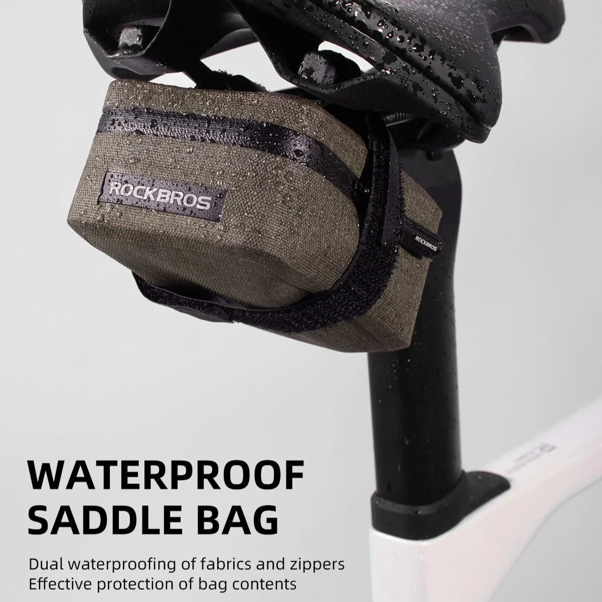Waterproof saddle bag attached to a bicycle with 'RockBros' branding on a light gray background.