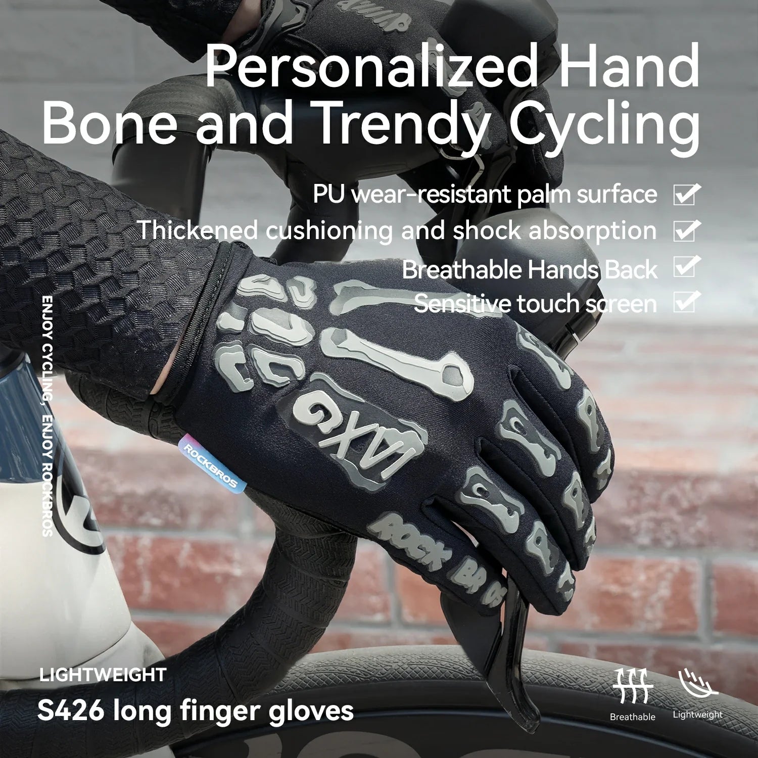 A close-up of a black cycling glove with white skeletal bone graphics on the back of the hand, worn on a hand gripping a bicycle handlebar. The image features promotional text overlays highlighting features like 'Personalized Hand Bone and Trendy Cycling' and 'S426 long finger gloves'.