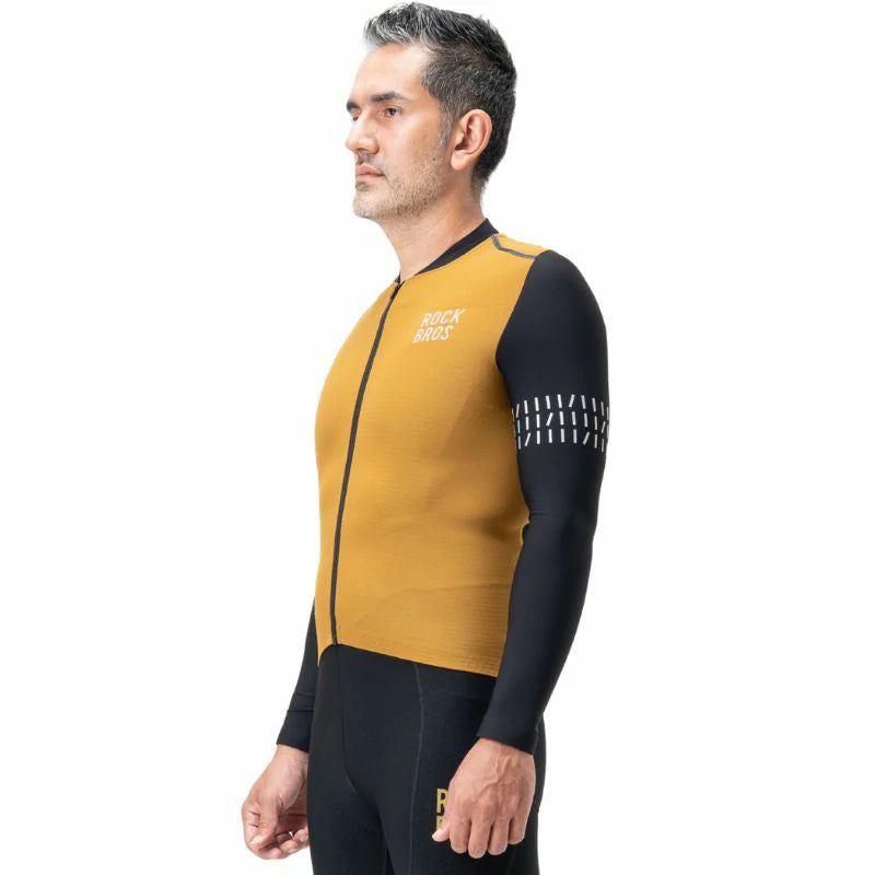 Man wearing a mustard yellow and black cycling jersey on a white  background #color_Brown