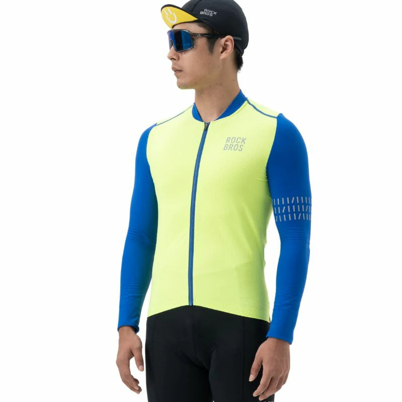 Person wearing a bright yellow and blue cycling jersey on a white background #color_Yellow