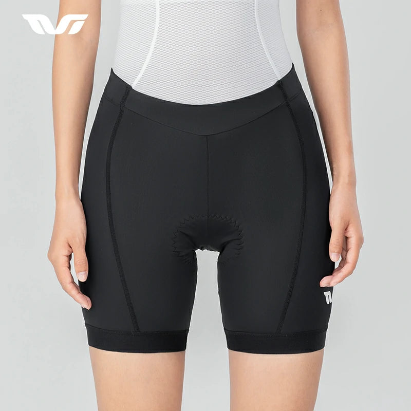 Black cycling shorts worn by a person on a gray background