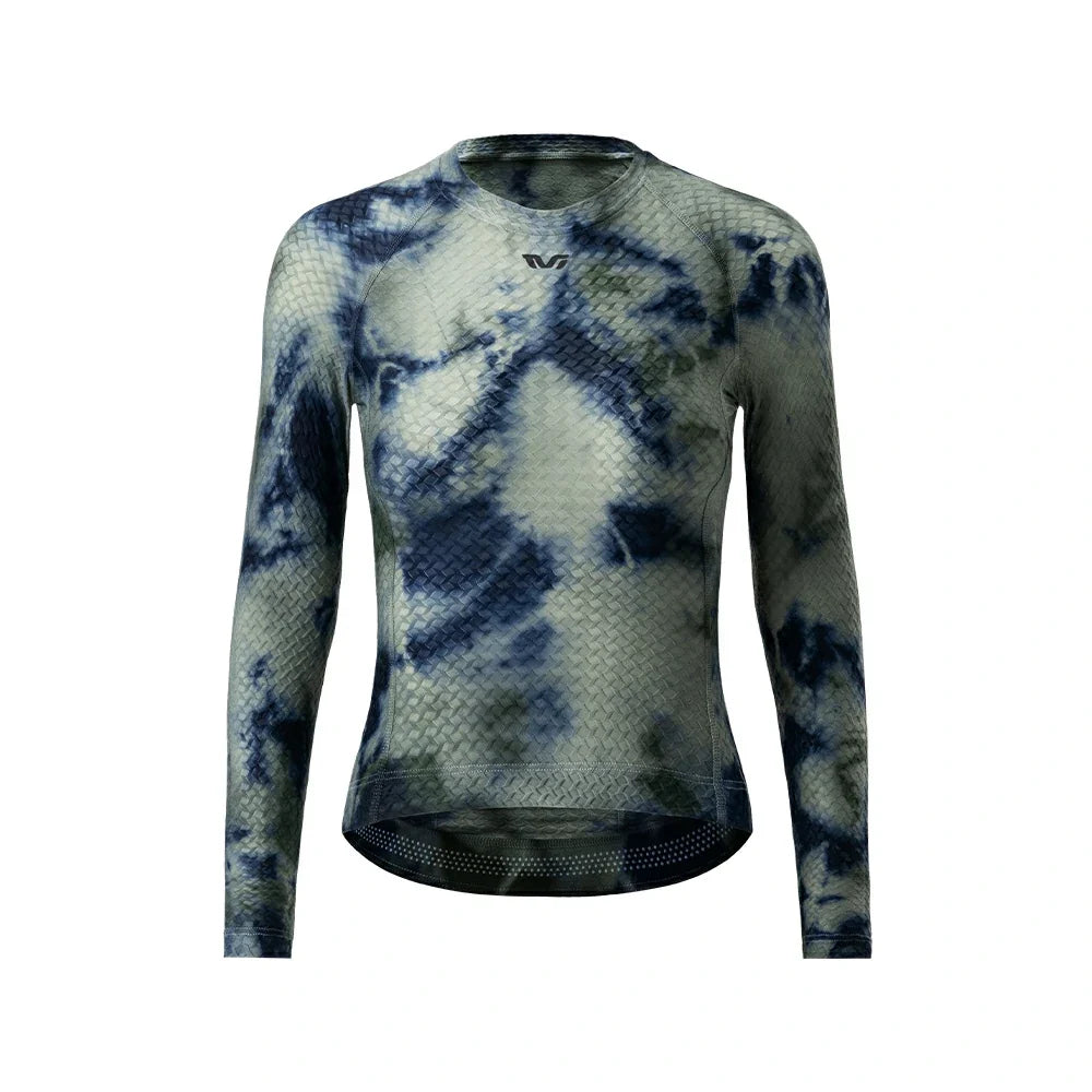 A long-sleeve athletic compression top with a blue and gray tie-dye pattern, featuring a textured mesh fabric and a small black logo on the chest, displayed on a solid white background.  #Color_Gray